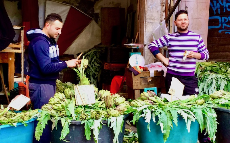men selling artichokes in - Catania Market, Sicily - Walking Tour of Italian Food Markets