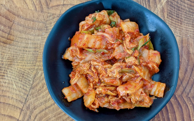 Quick Kimchi in a black bowl