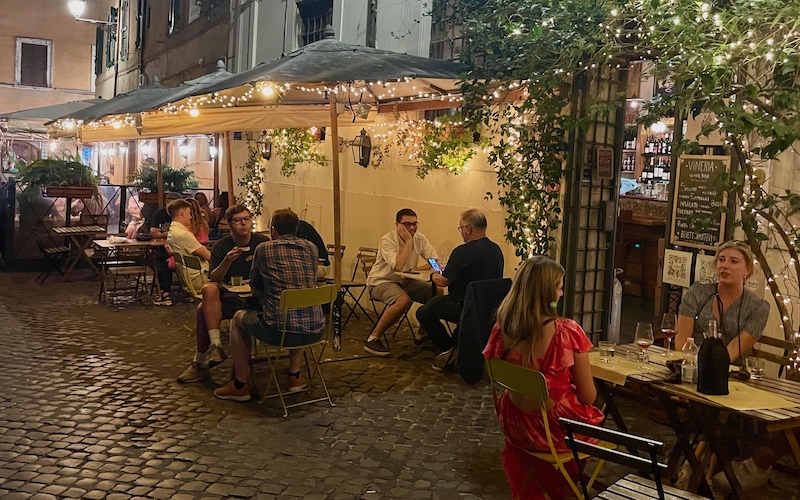 Best Wine Bars in Rome - Latteria Trastevere - outside tables on cooblestones