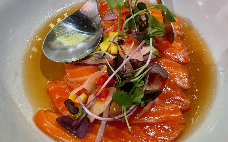 Best Dishes in Sydney - King Salmon crudo, mango, chilli, avocado, pickled ginger, Spanish onion, micro herbs and housemade ponzu sauce