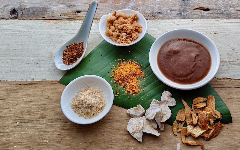 How To Make Asian Basics - Thai Basics (clockwise from top left roasted dried chilli powder, pork scratchings, Tamarind liquid, deep-fried garlic, dried galangal, dried turmeric powder, dried prawn floss