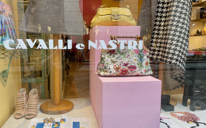 Milan Food Guide (Cheap Eats in Milan) - Cavalli e Nastri shop window with Valentino handbag