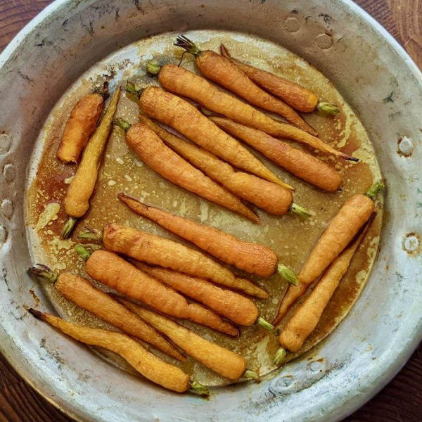 Baked Honey Glazed Carrots - baby carrots in a baking dish