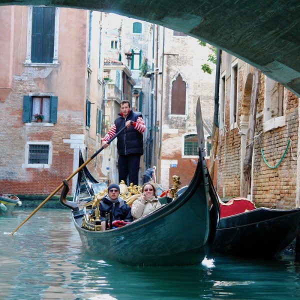 Gondola going under a bridge - Venice Food & Wine Tour