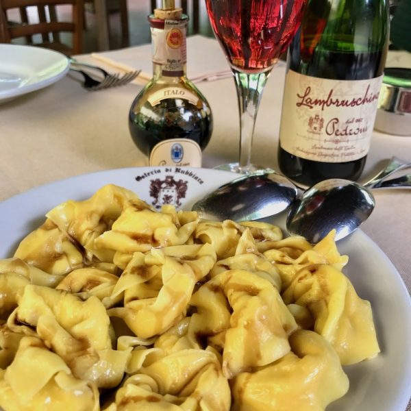 Ravioli with balsamic vinegar and a glass of Lambrusco at Osteria Rubbiara in Modena - Italian Food & Wine Tour