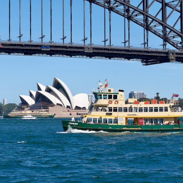 Sydney City Guide - ferry in front of opera house with harbour bridge above